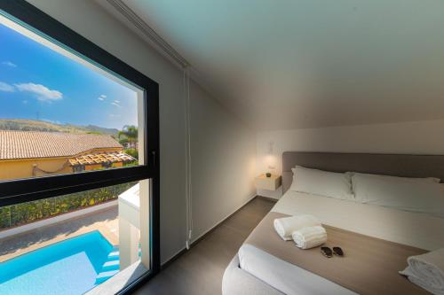 En eller flere senge i et værelse på Gelso Bianco Boutique Apartments