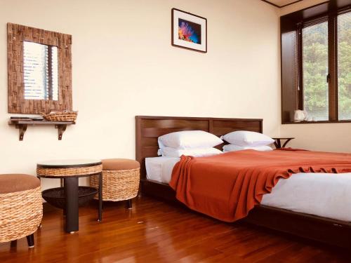 Ένα ή περισσότερα κρεβάτια σε δωμάτιο στο KAYA RESORT KOURIJIMA - Vacation STAY 95302v