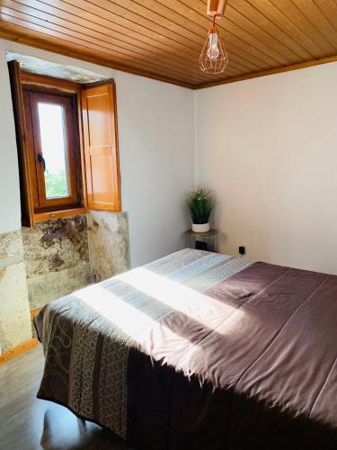 Ένα ή περισσότερα κρεβάτια σε δωμάτιο στο "Casa do Avô Armindo" Mountain Experience