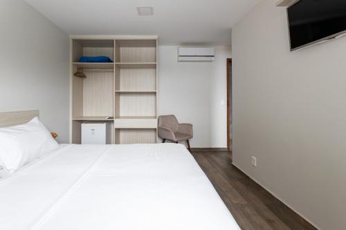 Ένα ή περισσότερα κρεβάτια σε δωμάτιο στο Pousada Casa da Praia Angra