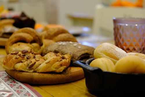 a bunch of different types of bread on a table at Peperosa in collina B&B in Pescara