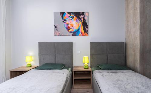 Posteľ alebo postele v izbe v ubytovaní Dąbska Street Krakow - Luxury Apartments