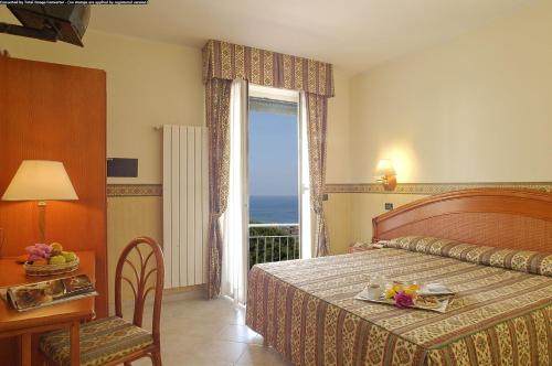 Posteľ alebo postele v izbe v ubytovaní Hotel Casella