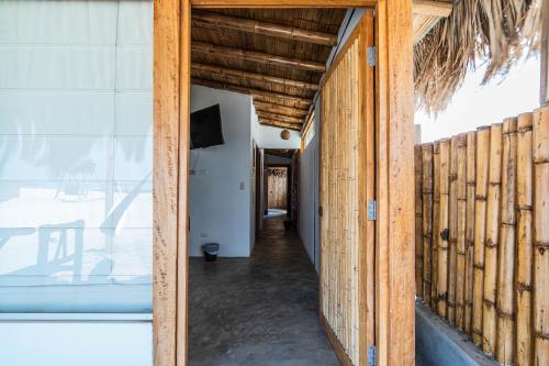 a hallway of a house with wooden walls at Vistazul in Vichayito