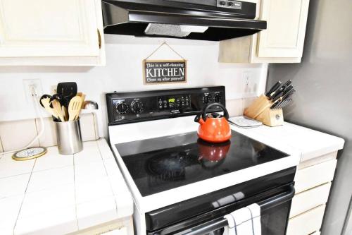 a kitchen with a stove with a tea kettle on it at COZY Condo at Canyon Lodge! Sleeps 8, a walk to Canyon Lodge in Mammoth Lakes