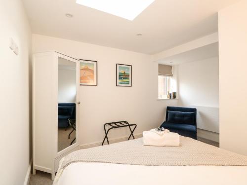 Un pat sau paturi într-o cameră la The Pinfold