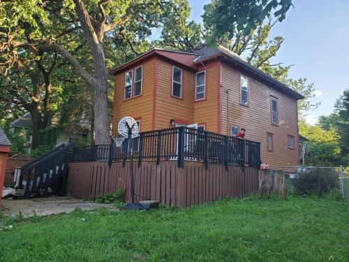 a large house with a fence in front of it at Beautiful Two Story Home by Fountain Lake and Mayo Clinic in Albert Lea