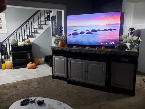 a living room with a large flat screen tv at Beautiful Two Story Home by Fountain Lake and Mayo Clinic in Albert Lea