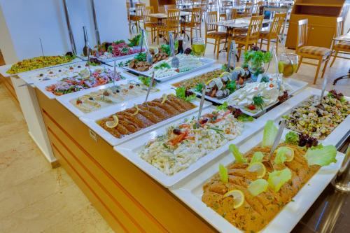 a buffet with many different types of food on display at Hotel Grand Efe in Ozdere