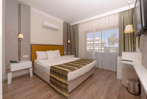 Säng eller sängar i ett rum på Armas Gul Beach