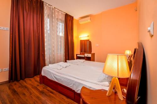 A bed or beds in a room at Glitter ~2-BDR Flat by National Palace of Culture