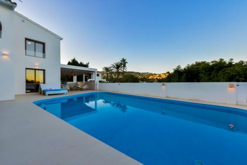 a swimming pool in the backyard of a house at LA MAR - Managed by Almarina in Benissa