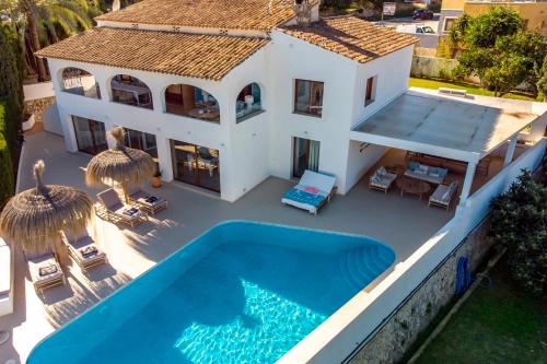 an aerial view of a house with a swimming pool at LA MAR - Managed by Almarina in Benissa