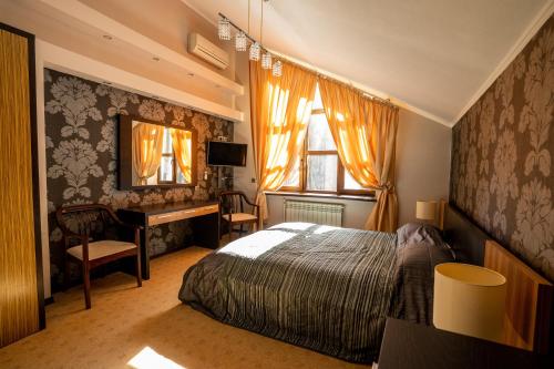 Ένα ή περισσότερα κρεβάτια σε δωμάτιο στο Парк Отель Русский