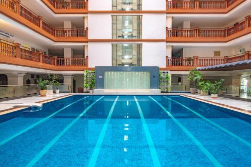 a swimming pool in the middle of a building at MekongView 2 CondoTel in Phnom Penh