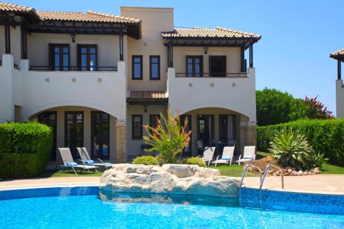 The swimming pool at or near Aphrodite Hills Golf & Spa Resort Residences - Junior Villas