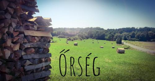 a field with hay bales in a field with the word expect at Őrségi Katicás Vendégház in Viszák