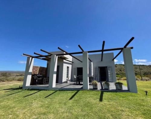 a rendering of a house with a large yard at Owl Cottage - Living The Breede in Malgas