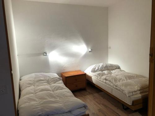 Postel nebo postele na pokoji v ubytování Apartment Residenza Quadra Flims
