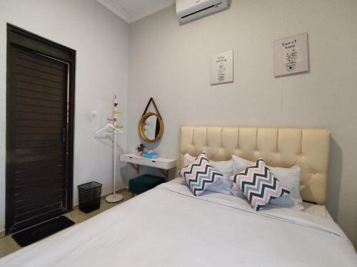 Ένα ή περισσότερα κρεβάτια σε δωμάτιο στο Alana House Syariah