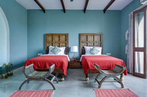Cama o camas de una habitación en Maya Garh Pushkar