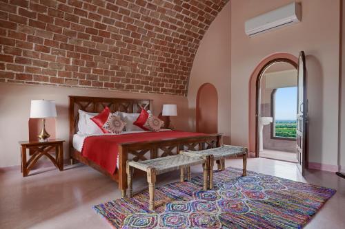 Cama o camas de una habitación en Maya Garh Pushkar