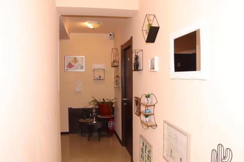 a hallway with a door and some pictures on the wall at Casa Amurg in Sinaia