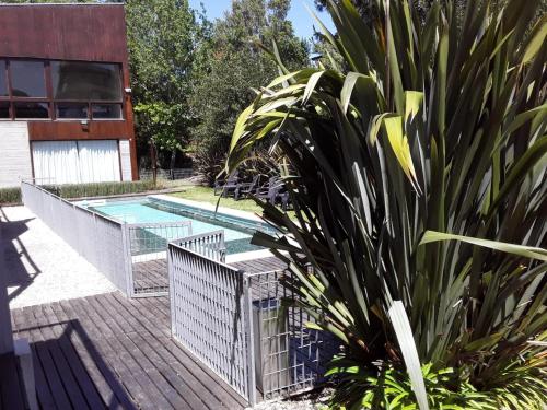 a pool with a fence and a plant next to it at Aguamansa in Las Gaviotas