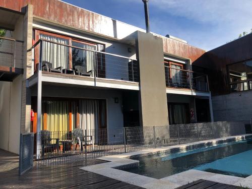 a house with a swimming pool in front of it at Aguamansa in Las Gaviotas