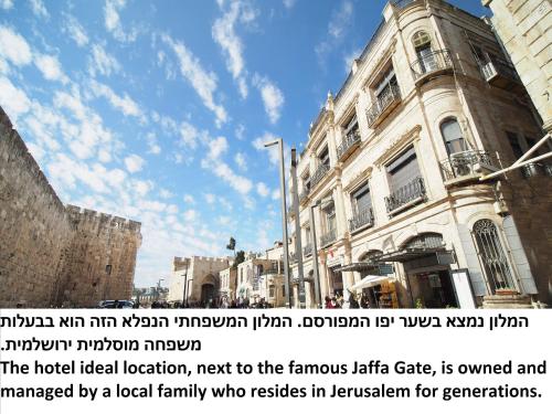 a building with a sign on the side of it at New Imperial Hotel in Jerusalem