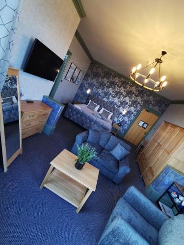 an overhead view of a living room with blue furniture at Hotel Victoria in Lowestoft