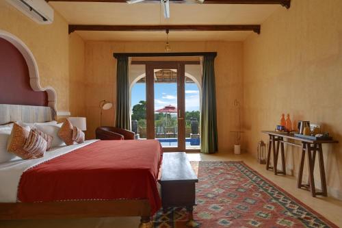 Cama o camas de una habitación en Maya Garh Pushkar