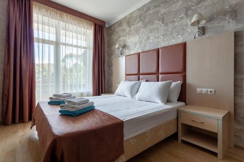 Ένα ή περισσότερα κρεβάτια σε δωμάτιο στο Грейс Кристалл Отель