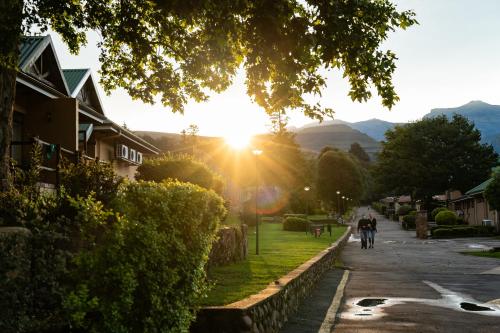 a person riding a bike down a street at Gooderson Drakensberg Gardens Golf & Spa Resort in Drakensberg Garden