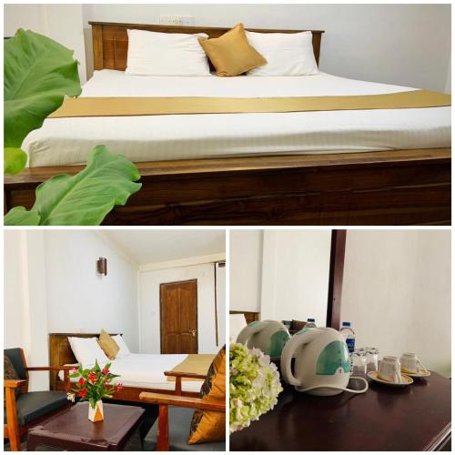 a hotel room with a bed and a table with a table at Golden King Guest in Nuwara Eliya