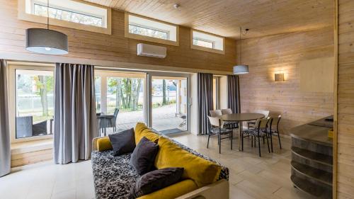 a living room with a couch and a table at Stranda in Giżycko