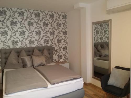Postel nebo postele na pokoji v ubytování Weingut Apartment Hildegard Gangl
