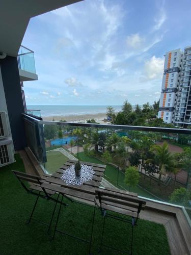 a balcony with two benches and a view of the beach at The Jomvacay Place in Kuantan