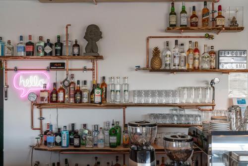 a kitchen filled with lots of bottles and bottles at BIG MAMA Leipzig in Leipzig