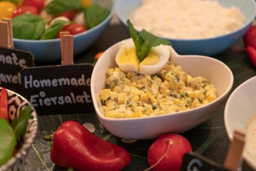 a bowl of food with vegetables and other foods at BIG MAMA Leipzig in Leipzig