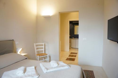 Ένα ή περισσότερα κρεβάτια σε δωμάτιο στο Il POGGIOLO SULLE EGADI