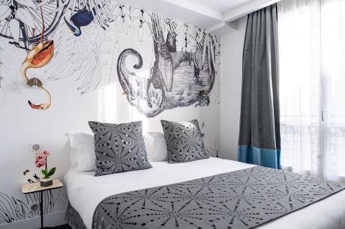 a bedroom with a bed with white sheets and pillows at Hotel Astoria - Astotel in Paris