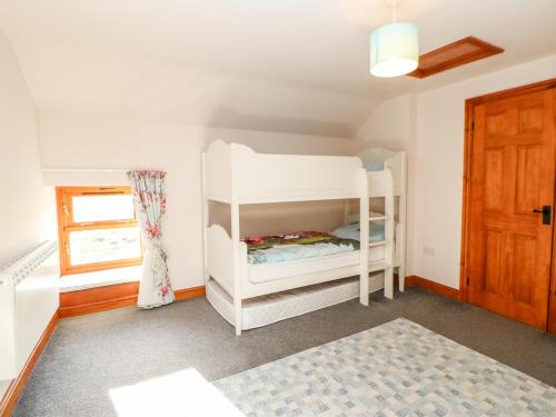 Dviaukštė lova arba lovos apgyvendinimo įstaigoje Blackburn Cottage Barn