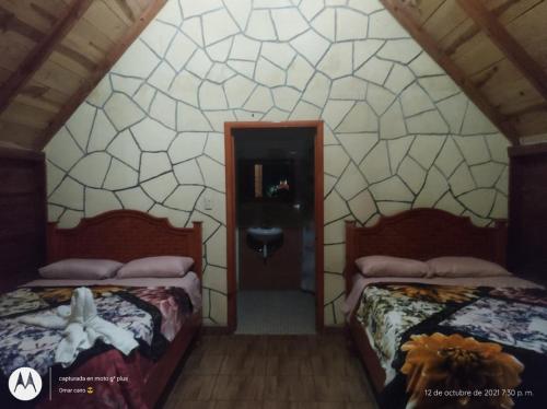 Cabañas camino realにあるベッド