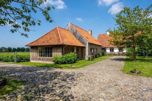 an estate with a house and a driveway at Loweide Lodges & Holiday Homes near Bruges in Oostkamp