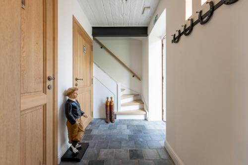 a statue of a woman standing in a hallway at Loweide Lodges & Holiday Homes near Bruges in Oostkamp
