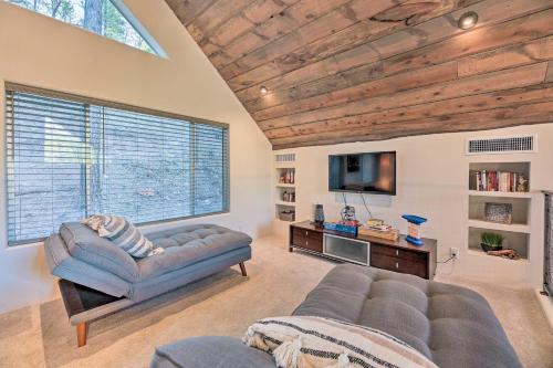a living room with a couch and a tv at Mtn-View Cabin 404 with Deck in Payson! in Payson