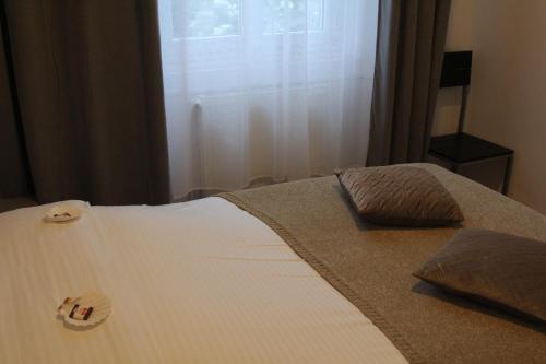 Ένα ή περισσότερα κρεβάτια σε δωμάτιο στο Residence Beau Rivage Brehec