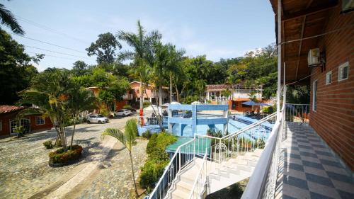 a balcony of a house with a swimming pool at Portón de Occidente by Bernalo Hotels in San Jerónimo