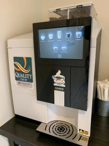 a coffee machine sitting on top of a table at Quality Inn & Conference Centre Downtown Sudbury in Sudbury